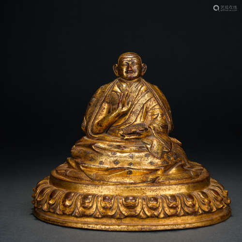 A Gilt Bronze Figure of a Seated Master, Qing Dynasty