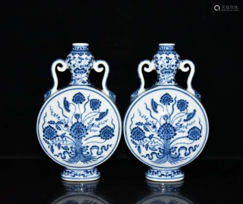 Blue and white with a bunch of lotus ears flat bottles of a ...