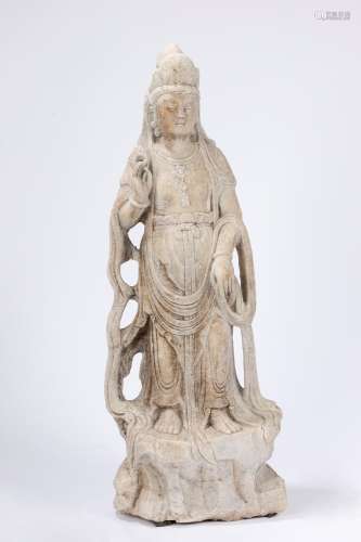 An antique indian stone sculpture depicting a Guanyin