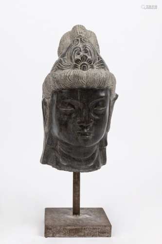 A dark patina stone head of buddha. India, 20th century