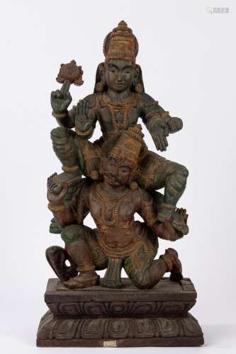 A polycrome wooden sculpture depicting Parvati and Shiva. 20...