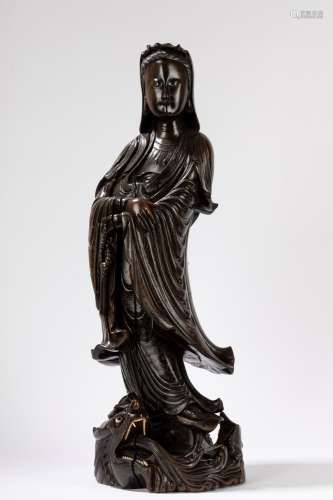 A finely carved wooden Guanyin. China, 20th century