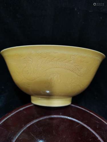 Chenghua yellow glaze dark carved dragon bowl
