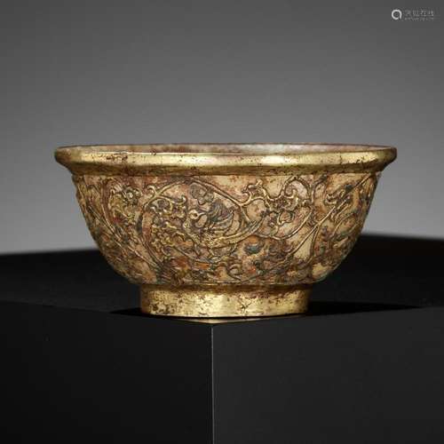 A GILT-COPPER REPOUSSÉ AND PALE CELADON JADE BOWL, LIAO DYNA...