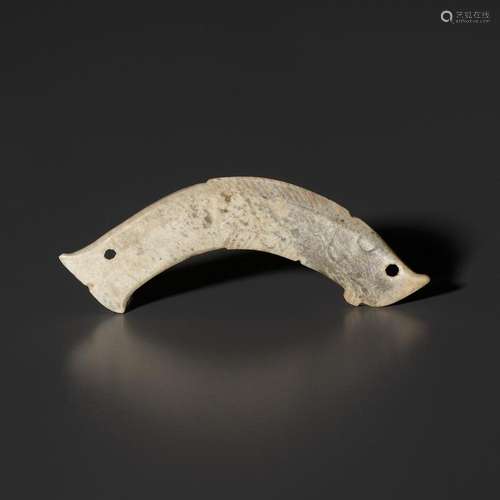 A PALE CELADON JADE ‘FISH’ PENDANT, LATE SHANG TO WESTERN ZH...