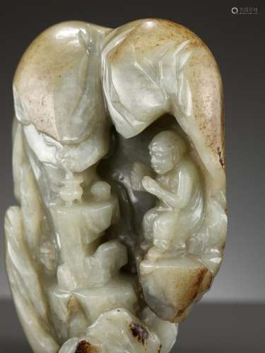 A CELADON AND RUSSET JADE ‘LUOHAN IN A GROTTO’ BOULDER, 17TH...