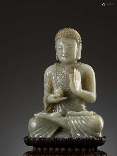 A CELADON JADE FIGURE OF BUDDHA, 17TH-18TH CENTURY