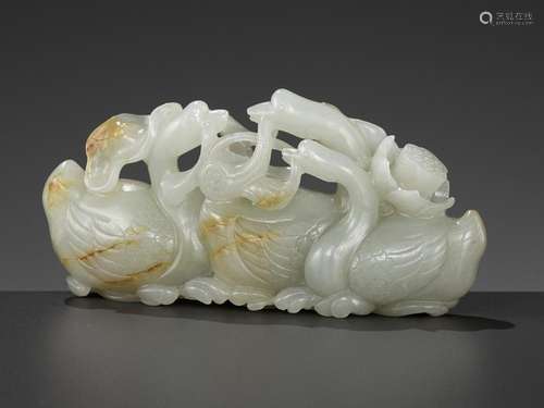 A CELADON AND RUSSET JADE GROUP DEPICTING THREE GEESE WITH L...