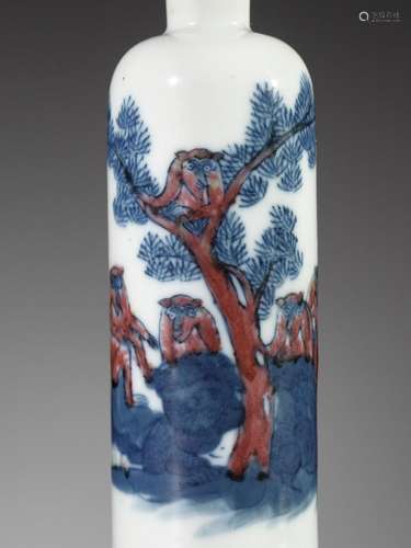 AN UNDERGLAZE-BLUE AND COPPER-RED ‘FIVE MONKEYS’ SNUFF BOTTL...