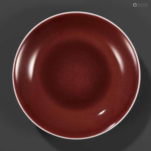 A COPPER-RED GLAZED DISH, WITH A LIVER-RED GLAZE POOLING IN ...