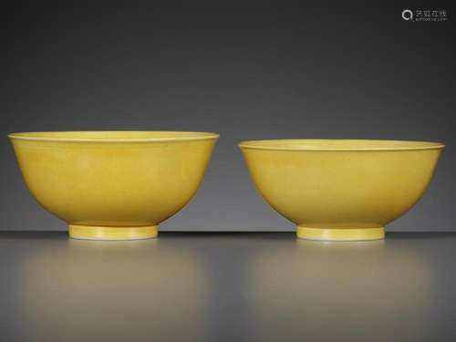 A NEAR PAIR OF IMPERIAL YELLOW-GLAZED BOWLS, DAOGUANG MARKS ...