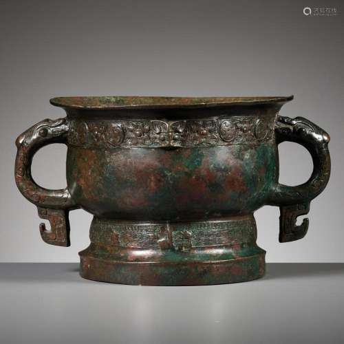 A ‘FIRE AND FOUR-PETAL LEAVES’ BRONZE RITUAL FOOD VESSEL, GU...