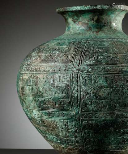 A RARE AND IMPORTANT BRONZE RITUAL WINE VESSEL, EASTERN ZHOU...