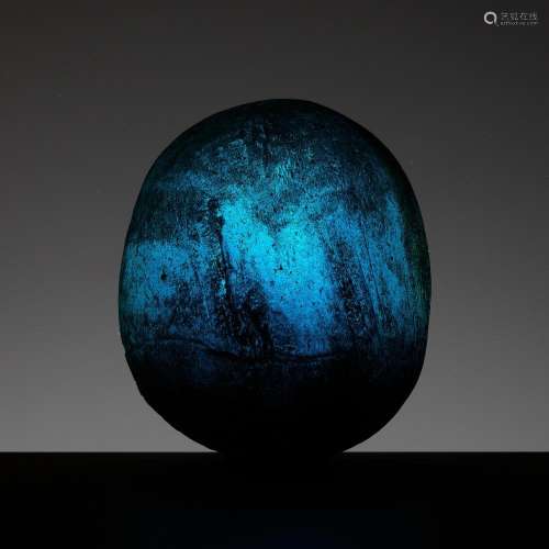 A TRANSLUCENT AQUAMARINE GLASS ‘COSMIC EGG’, HAN DYNASTY