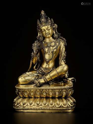 AN EXTREMELY RARE GILT-BRONZE FIGURE OF AVALOKITESHVARA IN R...