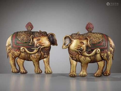 A PAIR OF GILT AND POLYCHROME-DECORATED COPPER REPOUSSÉ PLAQ...