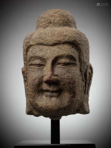 A MONUMENTAL SANDSTONE HEAD OF BUDDHA, NORTHERN WEI DYNASTY,...