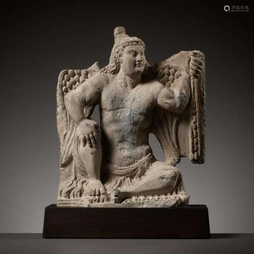 A GRAY SCHIST FIGURE OF A WINGED ATLAS, ANCIENT REGION OF GA...