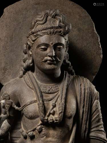 A LARGE AND IMPORTANT GRAY SCHIST FIGURE OF MAITREYA, ANCIEN...