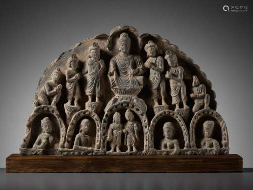 A GRAY SCHIST GABLE OF BUDDHA SURROUNDED BY HIS DISCIPLES, K...