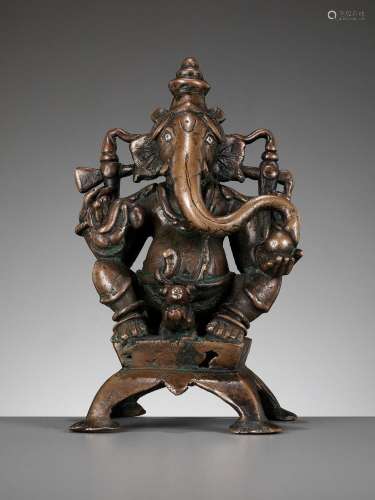 A SILVER-INLAID COPPER ALLOY FIGURE OF GANESHA, SOUTH INDIA,...