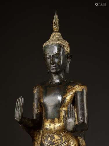 A RARE AND MONUMENTAL GILT-LACQUERED BRONZE FIGURE OF BUDDHA...