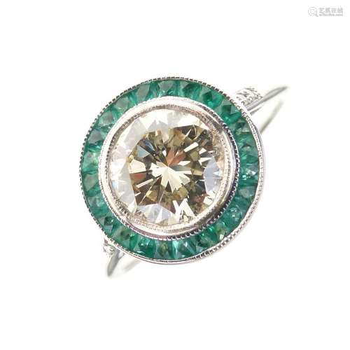 Diamond and calibre emerald ring