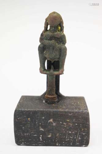 Cast bronze pipe tamper of a woman