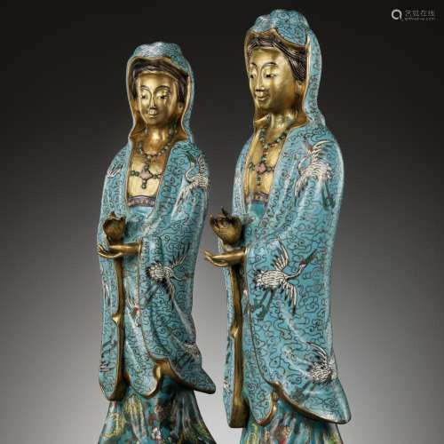 A RARE PAIR OF CLOISONNÉ ENAMEL FIGURES DEPICTING GUANYIN, Q...