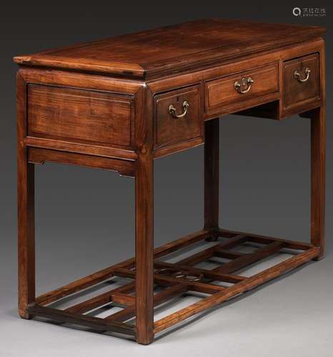 A HUANGHUALI THREE-DRAWER DESK, 19TH CENTURY