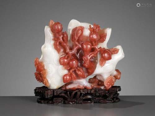 A CARNELIAN AGATE ‘PEACH AND LINGZHI’ RETICULATED DOUBLE VAS...