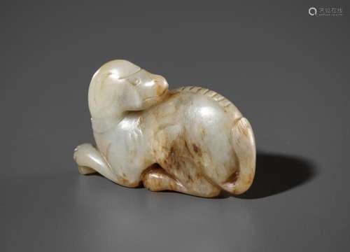 A CELADON AND RUSSET JADE FIGURE OF A RECUMBENT HOUND, MING ...