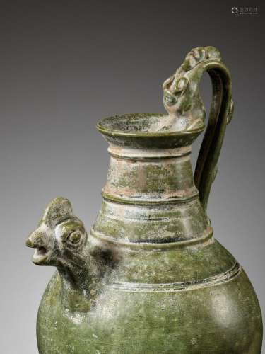 A GREEN GLAZED ‘CHICKEN HEAD’ EWER, TANG TO LIAO DYNASTY