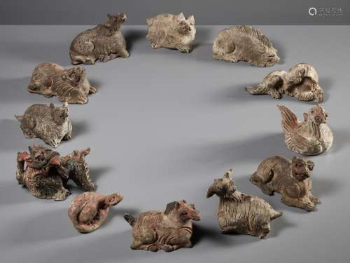 A COMPLETE SET OF TWELVE PAINTED POTTERY ‘ZODIAC ANIMALS’, S...