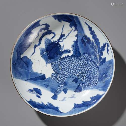 A LARGE BLUE AND WHITE ‘QILIN’ DISH, TRANSITIONAL TO EARLY K...