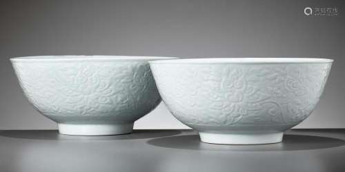 A PAIR OF LARGE CARVED PALE CELADON GLAZED ‘LOTUS’ BOWLS, EA...