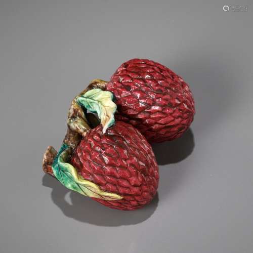 AN ENAMELED PORCELAIN CLUSTER OF LYCHEES, SERVING AS A BRUSH...