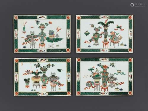 A SET OF FOUR FAMILLE VERTE ‘HUNDRED ANTIQUES’ PLAQUES, BY Y...