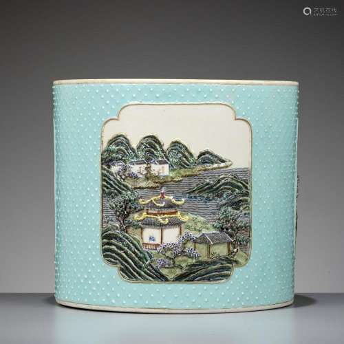 AN ELABORATELY MOLDED AND RETICULATED FAMILLE ROSE BRUSHPOT,...