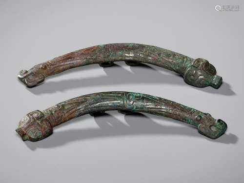 A PAIR OF ‘DRAGON AND TAOTIE MASK’ BRONZE CHEEK-PIECE FITTIN...