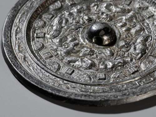 A SILVERED BRONZE ‘DEITIES AND BEASTS’ MIRROR, HAN DYNASTY