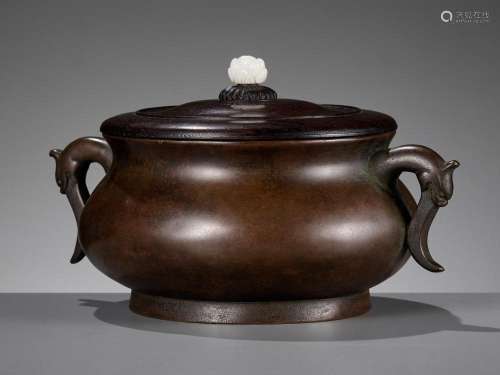 A BRONZE CENSER WITH A ZITAN WOOD COVER AND A WHITE JADE FIN...