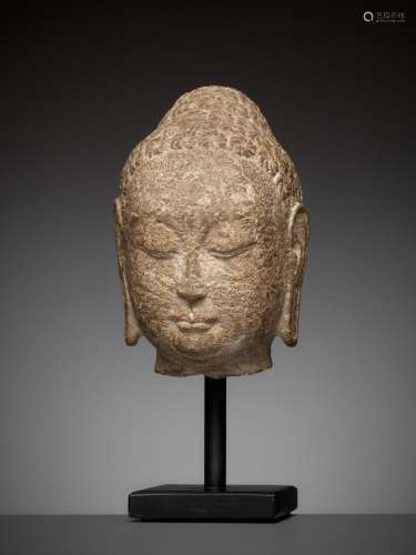 A FINE LIMESTONE HEAD OF BUDDHA, NORTHERN QI DYNASTY