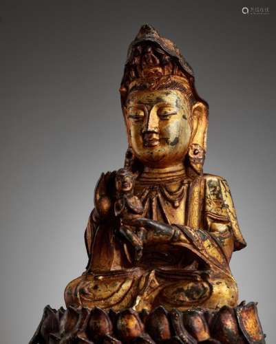 A GILT-LACQUERED BRONZE FIGURE OF SONGZI GUANYIN, MING DYNAS...