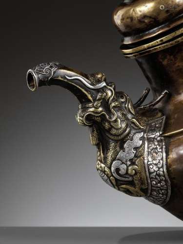 A PARCEL-GILT AND SILVER-APPLIED BRASS RITUAL TEAPOT