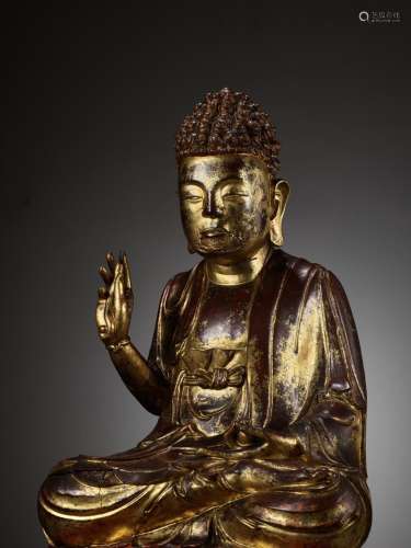 A LARGE AND HEAVY GILT-LACQUERED WOOD FIGURE OF BUDDHA