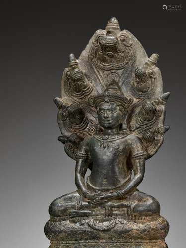 A BRONZE FIGURE OF BUDDHA MUCHALINDA, ANGKOR PERIOD, BAYON S...