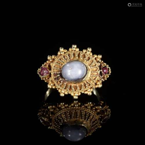 A GOLD PRIEST’S RING INLAID WITH A MOONSTONE AND TWO SMALL G...