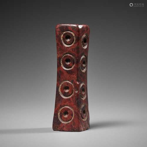 A BACTRIAN RED MARBLE FITTING, LATE 3RD TO EARLY 2ND MILLENN...