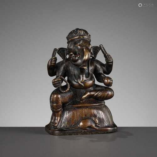 A SMALL BRONZE FIGURE OF GANESHA, SOUTH INDIA, 17TH - 18TH C...